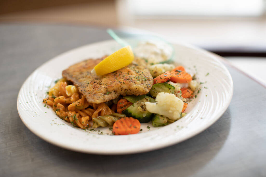 A plated chef-prepared meal in the community dining room
