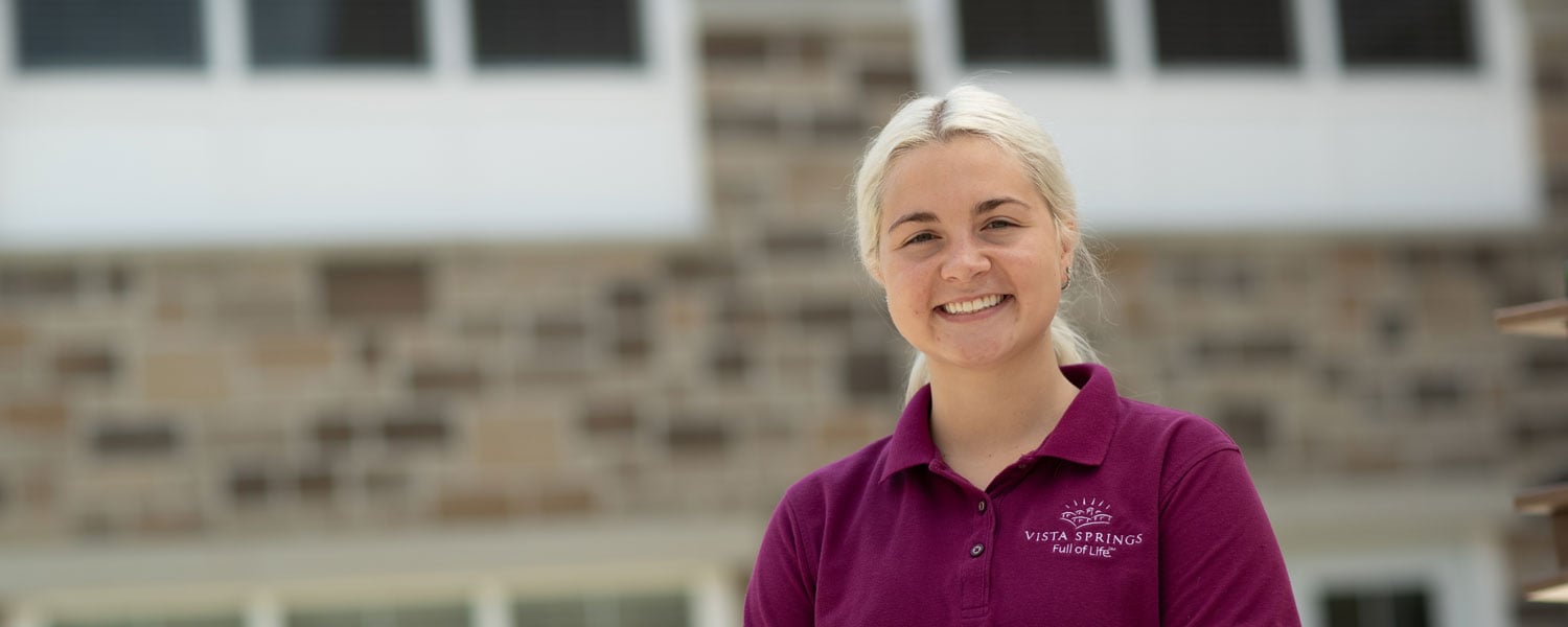 A Vista Springs team member smiling in a community kitchen