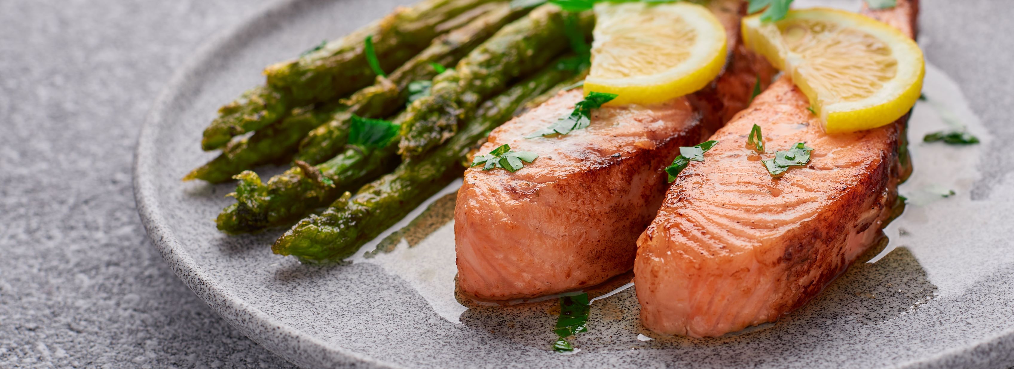 A chef-prepared salmon dish plated in the community dining room