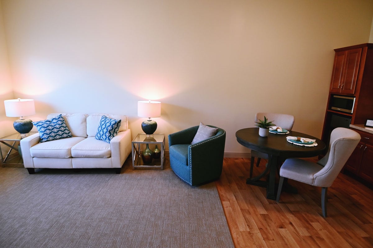 The living area of a residence, furnished and light-filled